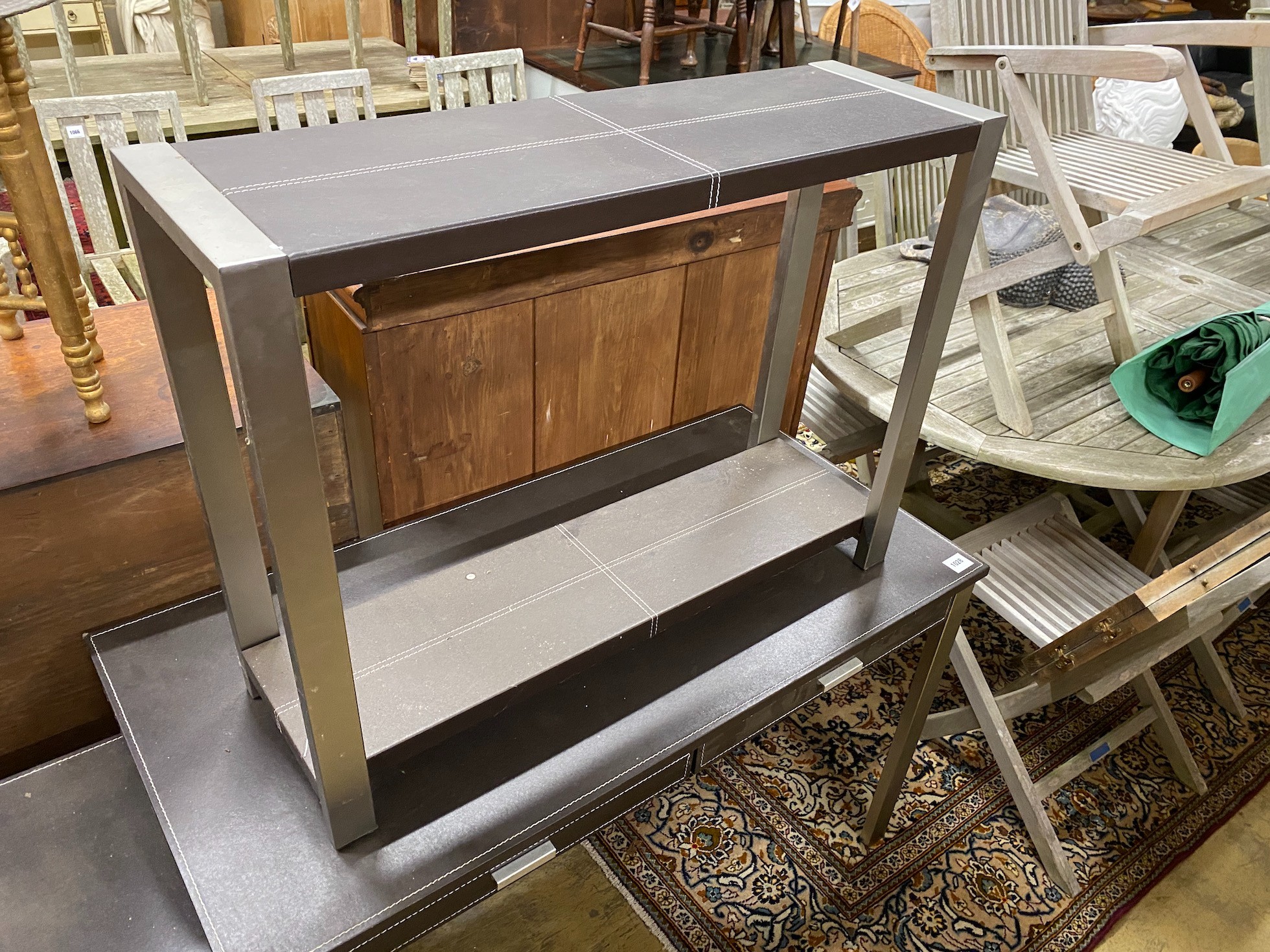 A leather topped and steel writing table, width 120cm, with matching three drawer chest, width 40cm and side table, width 92cm